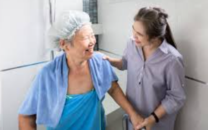How can families make showering more comfortable for older adults?